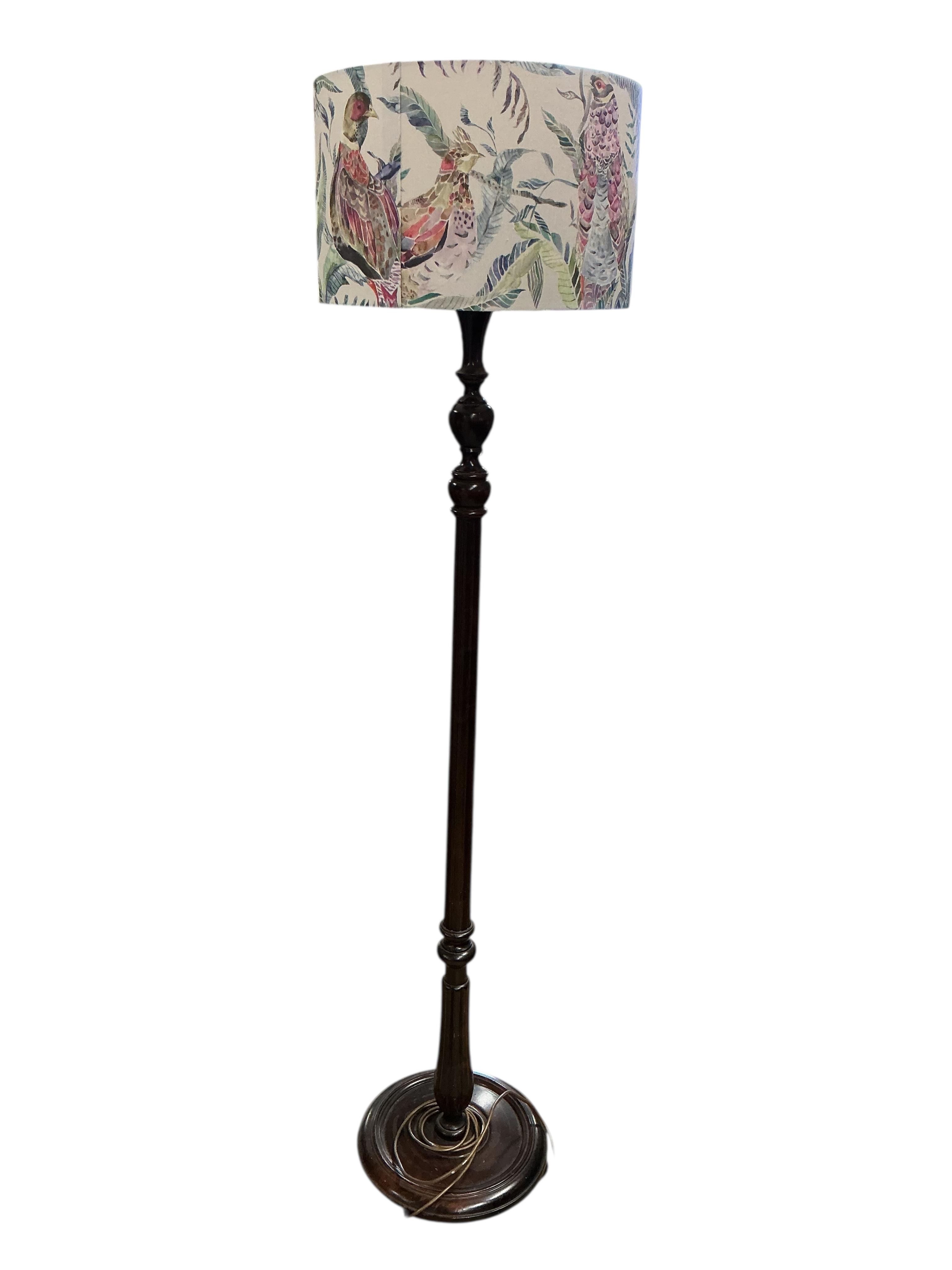A mahogany standard lamp with shade, height 170cm
